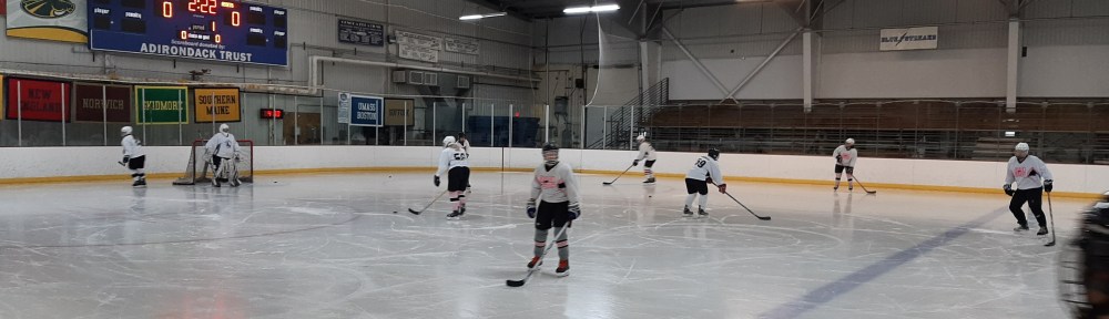 My wife's hockey team warming up at a rink in Saratoga Springs.