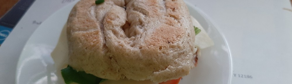 Homemade bagel with cream cheese and veggies and Swiss and Turkey.