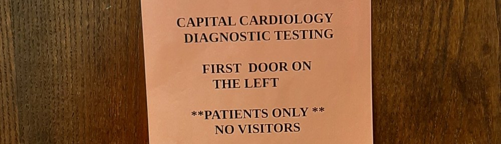 Printed sheet on door pointing to first door on the left, with an arrow pointing right.