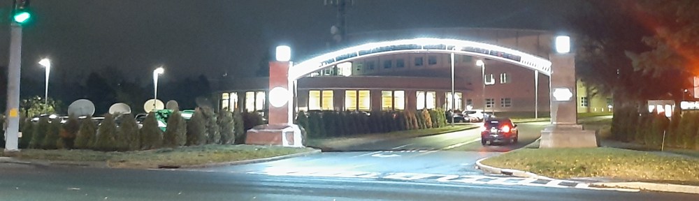 Shows archway with LED lights over entrance to HVCC school