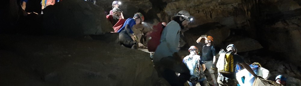 Image of line of caves on a slight slope. Some are blocked by a block on the left.