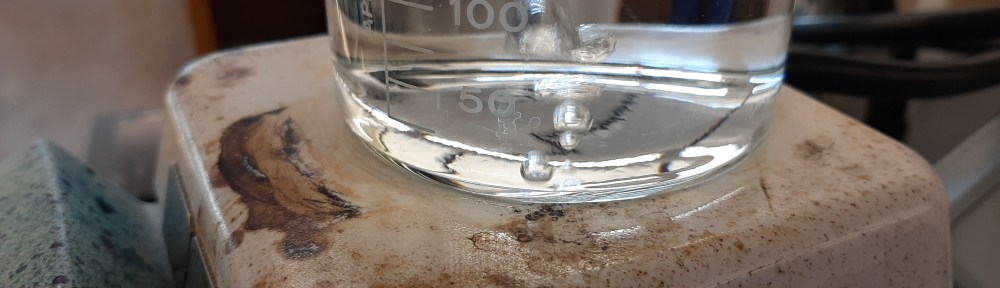 Beaker of water on hotplate. There's a single nucleation point causing the bubbles.