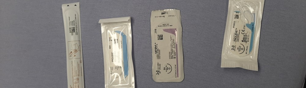 Image shows scalpel and some sutures