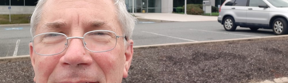 Selfie in front of an office building.