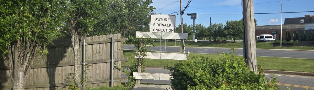 Sign at end of sidewalk "Future Sidewalk Connection"